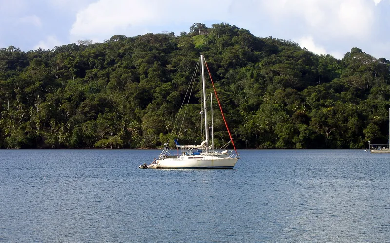 The sailboat moored out in the harbor