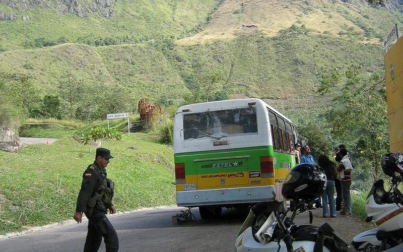 Waiting at the junction for the bus. That broken down bus isn´t mine.