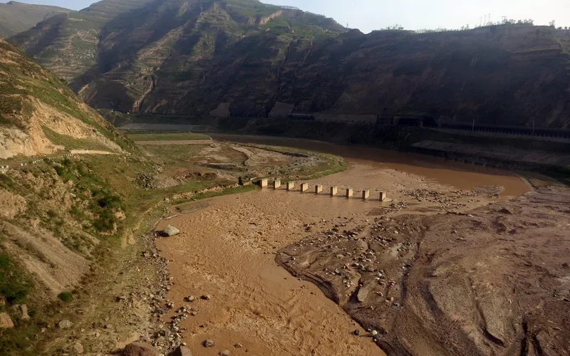 Bridge over muddy water, between Xian and Urumqi