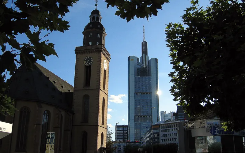 An old church and a modern skyscraper